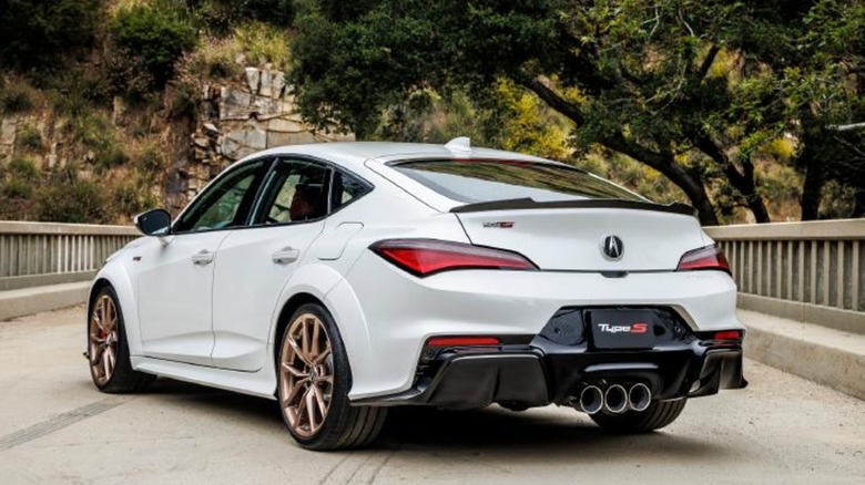 An Acura Integra Type S from behind on a road.