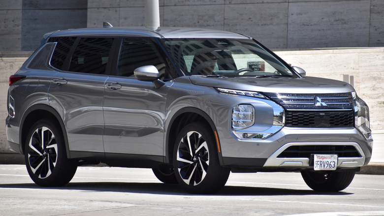 A Mitsubishi Outlander in a parking lot.