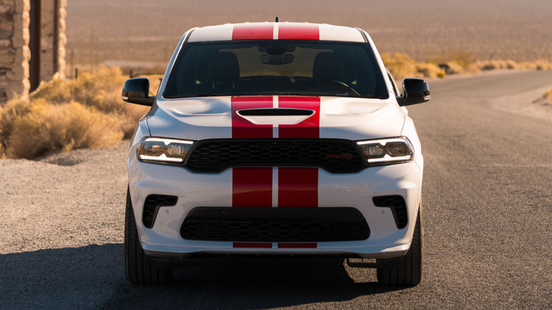 A 2026 Dodge Durango Hellcat painted in white with red stripes, in a desert setting