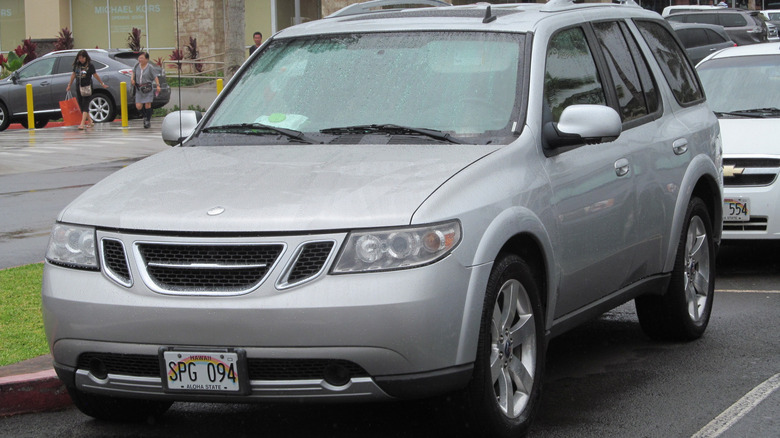 A silver 2009 Saab 9-7X Aero parked on the street.