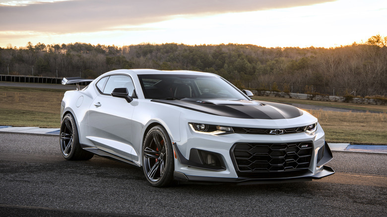 A white 2019 Chevrolet Camaro ZL1 1LE parked on racetrack with trees in background