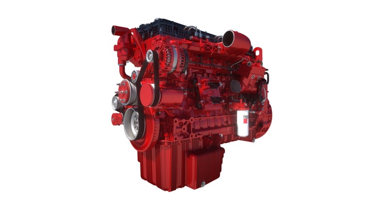 A 3/4 view of a red Cummins X15D Performance inline-6 semi truck engine with a capacity of 14.5 liters