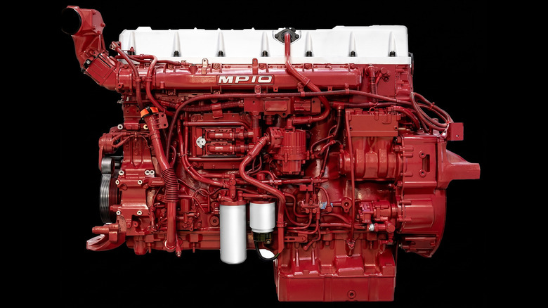 Red Mack MP10 16.1-liter turbodiesel inline-6 engine viewed from the side on black background