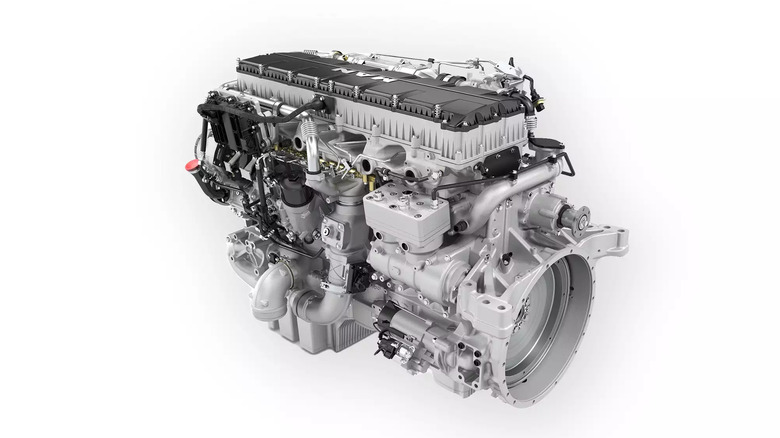 A 3/4 view of the MAN D3876 15.26-liter inline-6 turbodiesel semi truck engine on white background