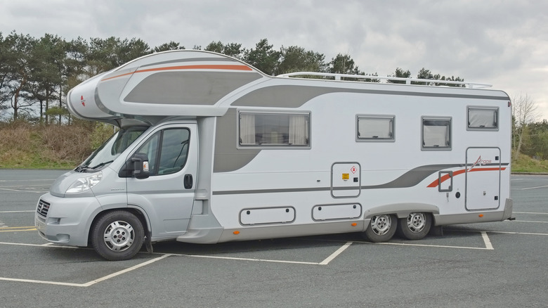 Super Tourer RV in a parking lot