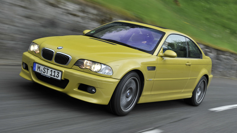 Front 3/4 view of a yellow BMW E46 M3