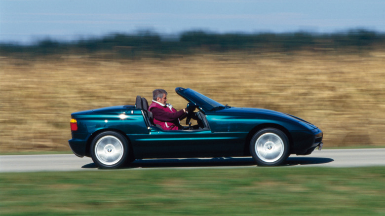 Side view of a green BMW Z1 driving