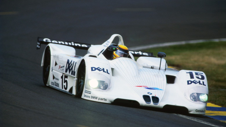 A white BMW V12 LMR race car on track