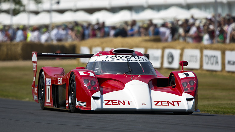 A red and white Toyota GT-One race car at Goodwood