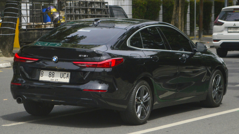 BMW 2 driving on a city street