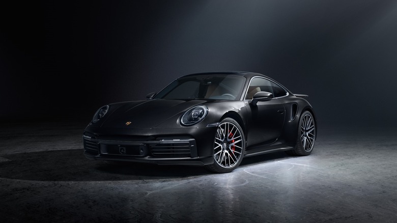 Front three-quarter image of a 992.1 911 Turbo in Black.