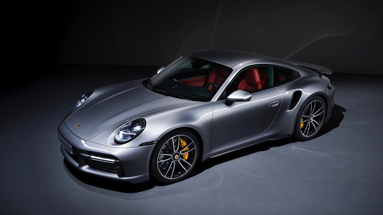 High-angle view image of a 2020 Porsche 911 Turbo S against black background.