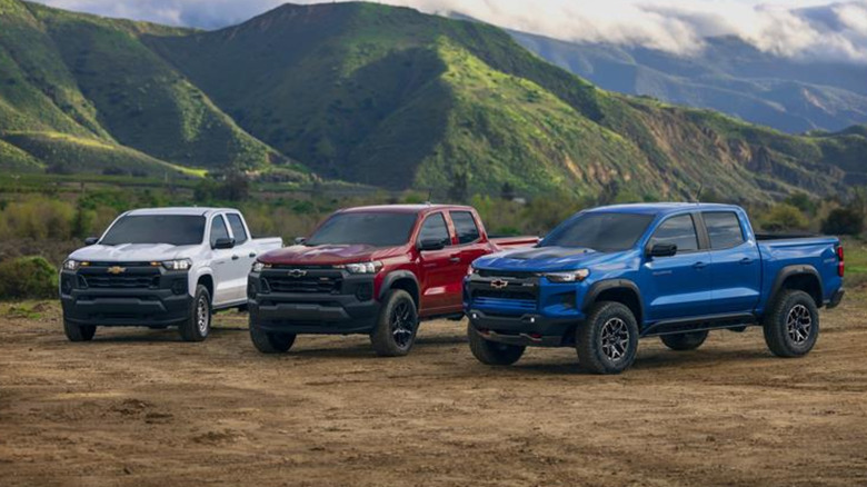 Multiple Chevrolet Colorado models parked on dirt next to each other