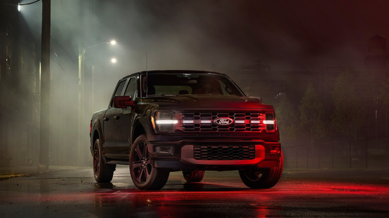 A black 2025 Ford F-150 Lobo Package during the night on a street