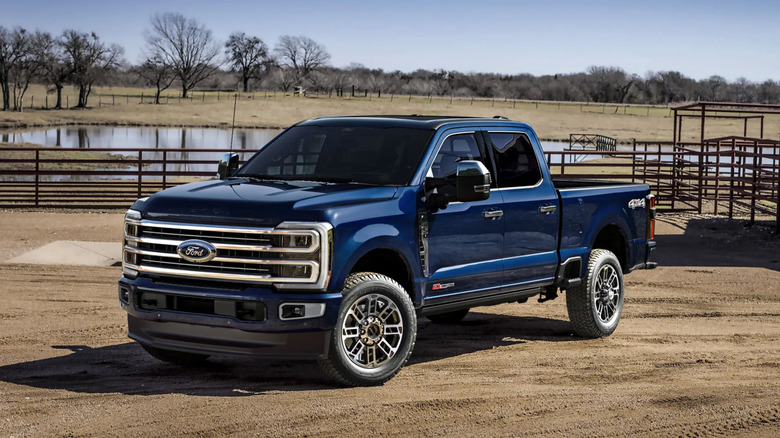 A dark blue 2025 Ford Super Duty parked on dirt