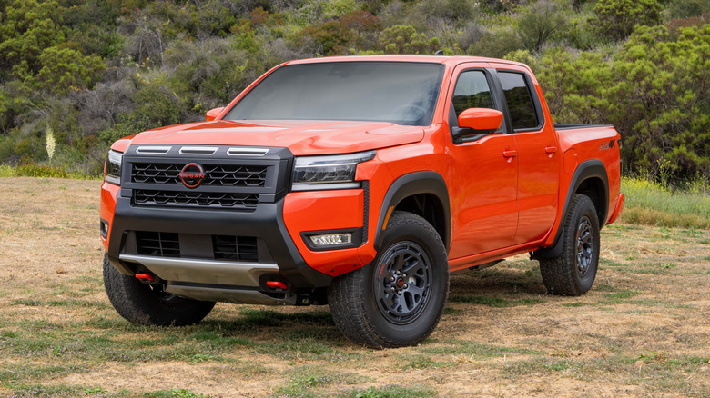 2026 Nissan Frontier PRO-4X parked off-road with a hillside in the background