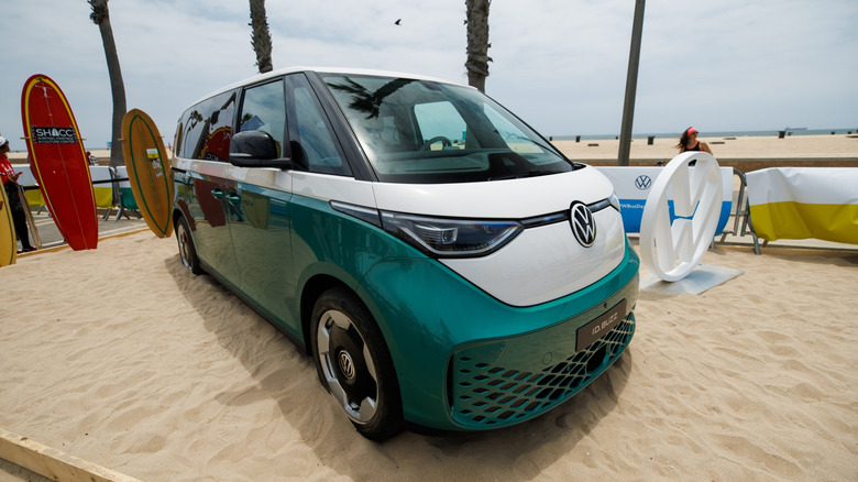 A front 3/4 of a 2023 VW ID.Buzz parked on sand for its debut