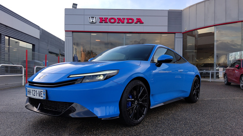 A blue Honda Prelude at a dealership
