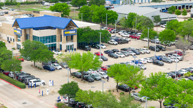 In an aerial view, pre-owned vehicles are displayed for sale at a Carmax dealership on April 07, 2026 in Austin, Texas.