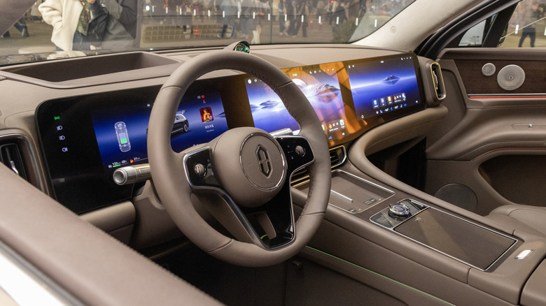 A vehicle's instrument cluster and infotainment screen with native software.