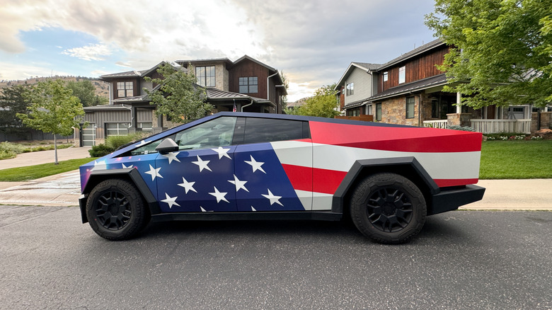 A Tesla Cybertruck with an American flag wrap