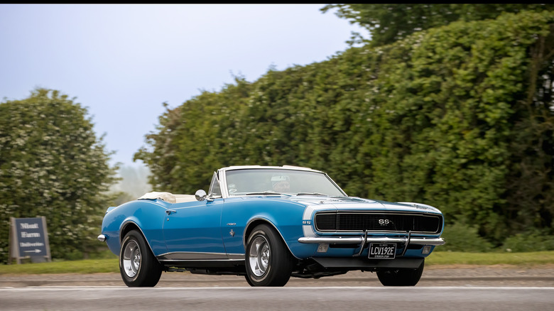 Bicester,Oxon.,UK - Apr 26th 2026: 1967 blue Chevrolet Camaro American car driving on a British road
