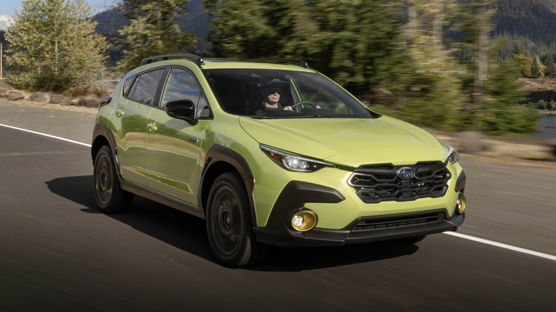 Subaru Crosstrek Hybrid driving along a forest road
