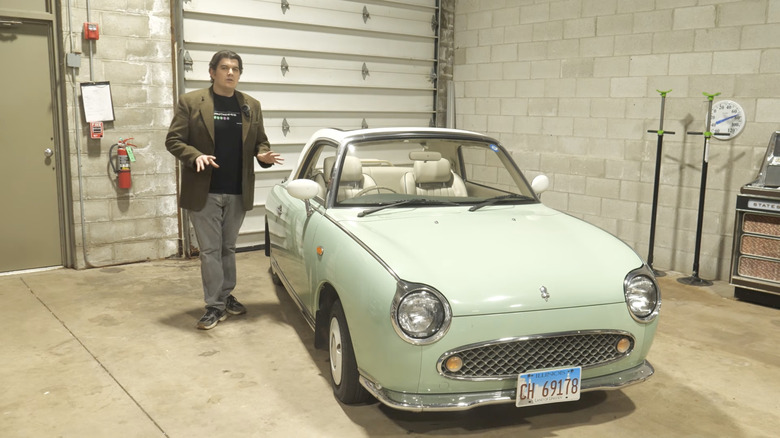 Host standing next to a small vehicle explaining that your car's engine only works because of a computer