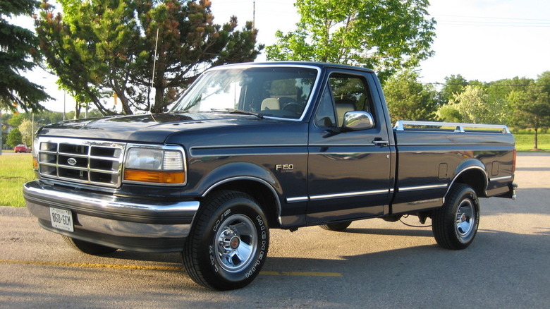 1987 Ford F-150 parked in a parking lot on a sunny day