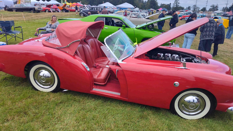 Side view of a red Kaiser Darrin