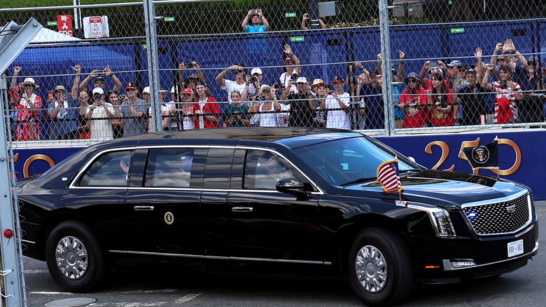 The presidential limousine, "The Beast," with U.S. President Donald Trump and first lady Melania Trump inside drives on the track of the NTT INDYCAR Series on August 23, 2026 in Washington, DC.