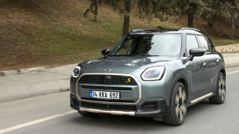 A MINI Countryman driving on the road.
