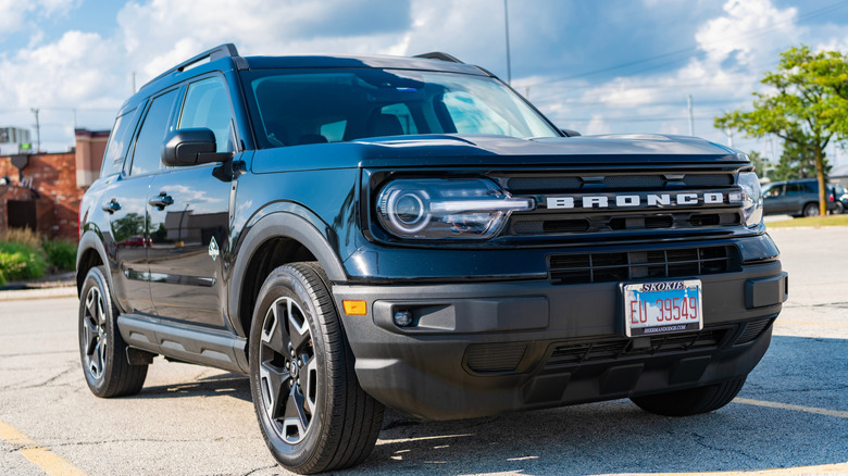 A Ford Bronco Sport sitting in a parking lot.