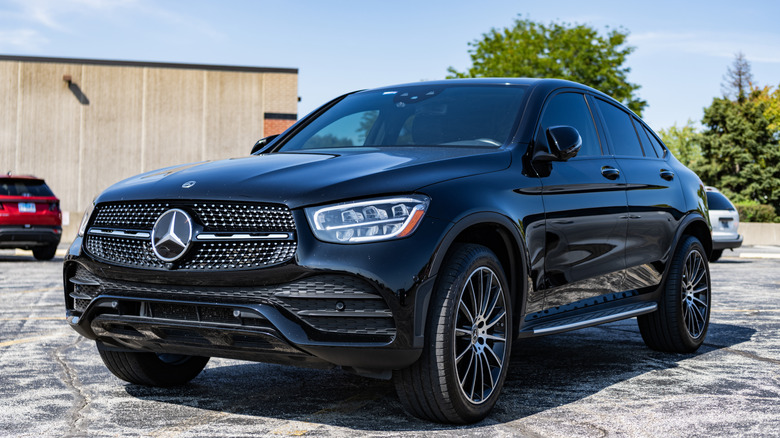 A black Mercedes-Benz GLC sitting in a parking lot.