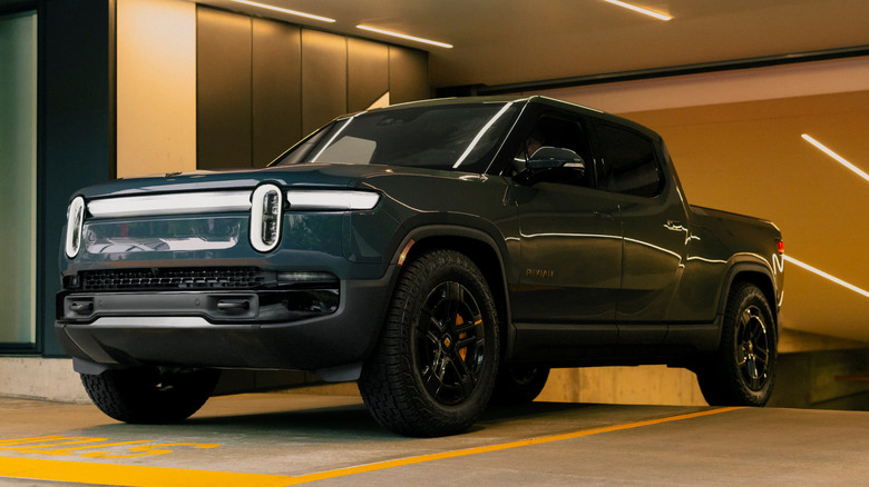 Rivian driving out of parking garage
