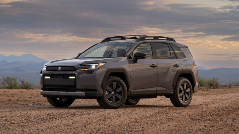 A gray 2026 Toyota RAV4 parked in a desert environment.