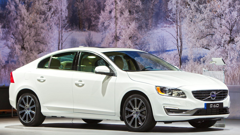 White Volvo S60 sedan on display at an auto show