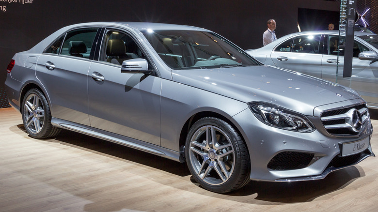 Silver Mercedes-Benz E-Class parked at an auto show