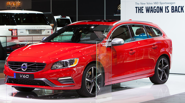 Red Volvo V60 wagon on display at an auto show