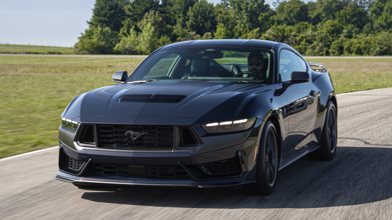 A Mustang Dark horse in motion.