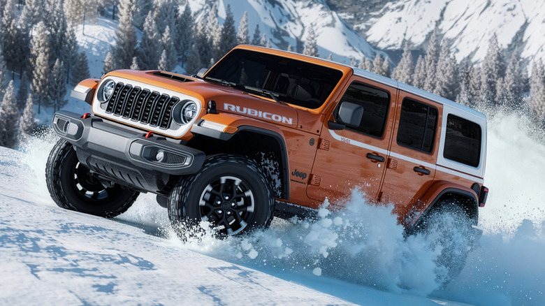 Press image of Jeep Wrangler Whitecap Edition climbing a snowy hill.
