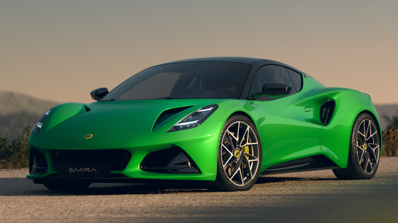 A green 2026 Lotus Emira parked in a press image.