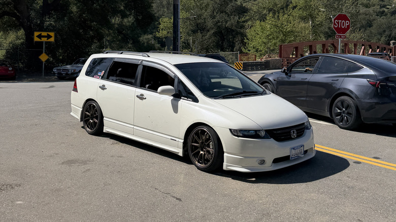 Front 3/4 view of a white JDM Honda Odyssey