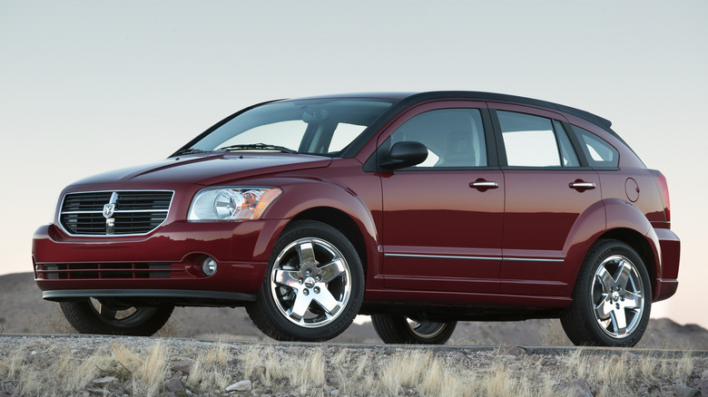 A red 2007 Dodge Caliber at its launch on a rocky desert roadway.