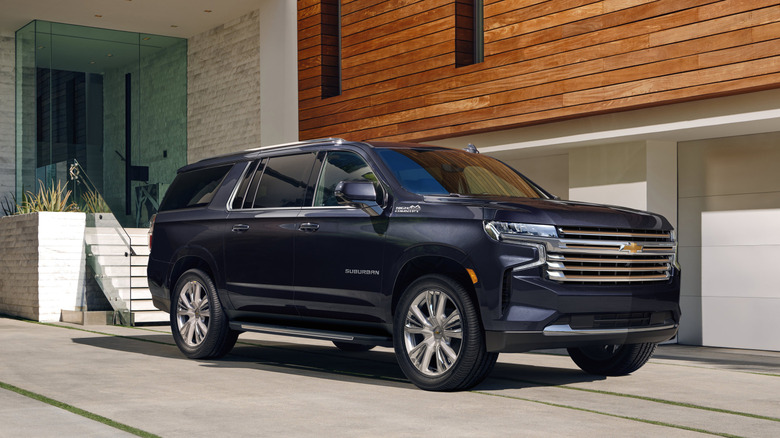 Suburban parked outside modern house