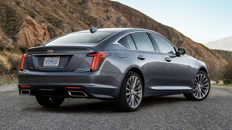 Black Cadillac CT5 parked in the desert.