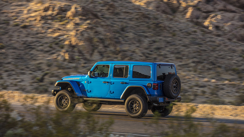 A blue jeep wrangler 392 driving through the desert