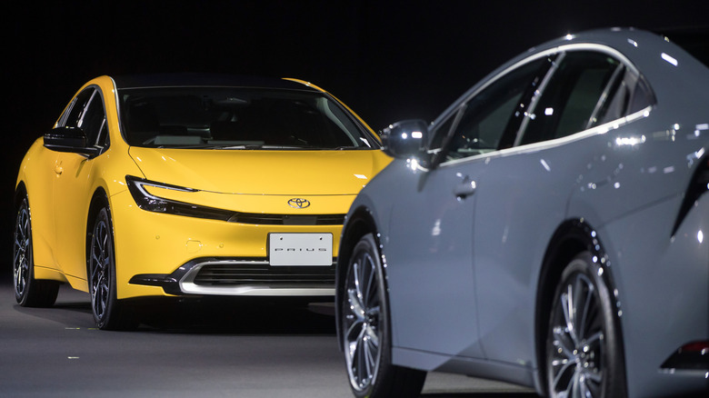 TOKYO, JAPAN - NOVEMBER 16: Toyota Motor Corp.'s Prius 2.0L plug-in hybrid electric vehicle (PHEV) prototype, left, and Prius 2.0L hybrid electric vehicle (HEV) prototype are displayed during the World Premiere of the All-New Prius on November 16, 2022 in Tokyo, Japan. Toyota unveiled the fifth generation of its Prius hybrid on Wednesday, as competition in the electric vehicle market starts to heat up globally. (Photo by Tomohiro Ohsumi/Getty Images)