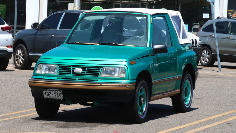 Longmont, CO USA - August 4, 2022: 1990s Geo Tracker small compact SUV with convertible to