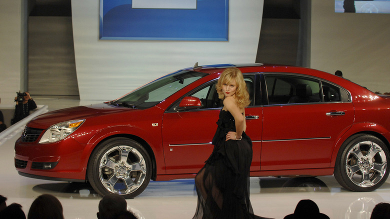 Actress Kristen Bell walks the runway with the Saturn Aura at the GM Style event on the eve of the 2007 North American International Auto Show January 6, 2007 in Detroit, Michigan. The first-ever invitation only GM Style showcased 17 GM vehicles paired with celebrities and the latest fashions. In addition to an array of classic GM Designs, including the 2006 Camaro Concept and the 1951 Buick LeSabre Concept, four global concepts never before seen in North America were shown